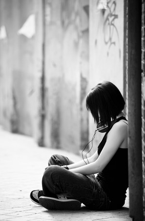 Young beautiful urban girl with headphones.の写真素材