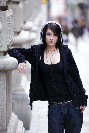 Young beautiful pierced girl with headphones.の写真素材