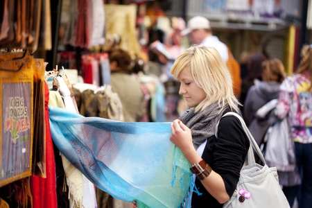Young blond girl sopping some muslim goods.の写真素材