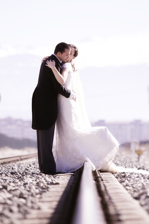 Young just married couple on railway road.の写真素材