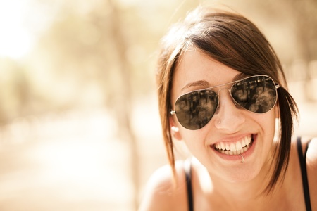 Young beautiful pierced girl smiling at camera.の写真素材