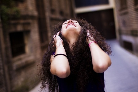 Young beautiful girl enjoying music from her headphones.