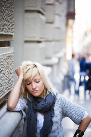 Young casual urban girl with sad expressionの写真素材