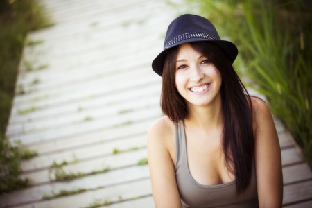 Cheerful young beautiful woman in natureの写真素材
