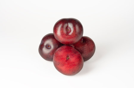 Red plum isolated on white backgroundの写真素材