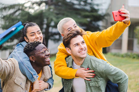 Young group of students taking a selfie in the campus.の写真素材