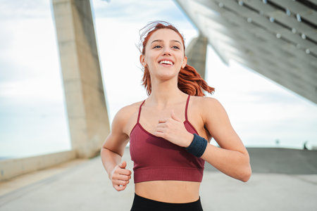 Young sport woman running for health, wellness or training for a marathon, competition or race,...