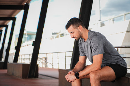 Dedicated Sportsman Taking a Break to Rest and Collect His Thoughts After an Intense Workout...