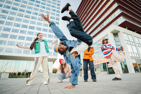Dynamic breakdancer performing impressive moves showcasing talent and skill in energetic dance routineの写真素材