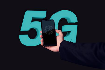 hand holding a smartphone with 5g technologyの写真素材