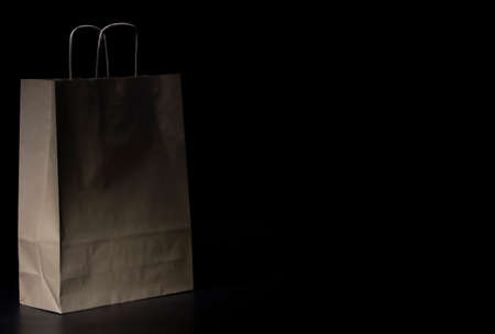 paper bag for shopping on black backgroundの写真素材