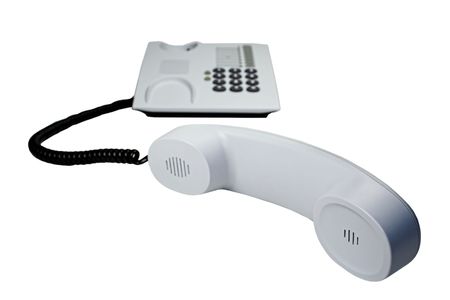 Office telephone with sinuous cord isolated on white.の写真素材