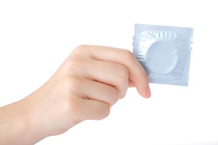 Hand holding a condom isolated on white background\nの写真素材