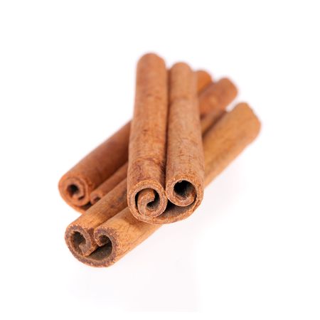 Cinnamon sticks isolated on a white backgroundの写真素材