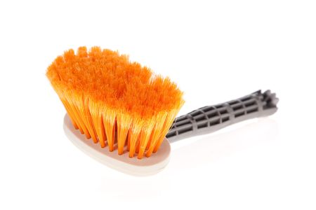Paintbrush or small broom used for whitewashing walls or sweeping on whiteの写真素材