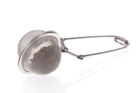 Tea infuser with Green Tea leaves isolated on a white backgroundの写真素材
