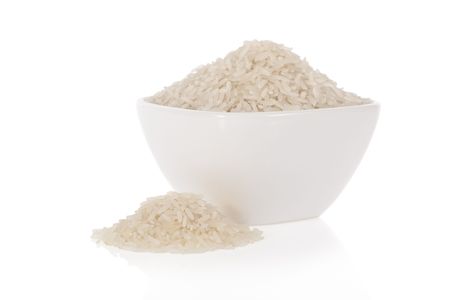 Long white rice in a bowl isolated on a white backgroundの写真素材