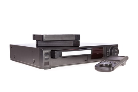 Old Video Cassette Recorder and tapes isolated on white backgroundの写真素材