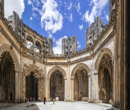 Batalha, Portugal - July 17, 2013  Tourists stroll around the interior of the Unfinished Chapels - Capelas Imperfeitas of the Batalha Monastery  UNESCO World Heritage Site のeditorial素材