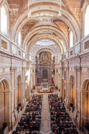 Mafra, Portugal - September 02, 2013  Basilica of the Mafra Palace filled with faithful during the Mass  Baroque architecture  Franciscan religious order のeditorial素材