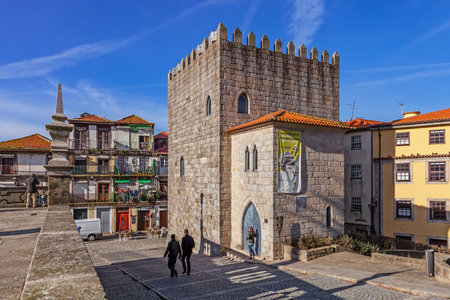 Porto, Portugal. December 29, 2014: The Medieval Tower of the Dom Pedro Pitoes Street seen from the Porto Cathedral Square aka Terreiro da Se. Romanesque architecture. Unesco World Heritage Siteのeditorial素材