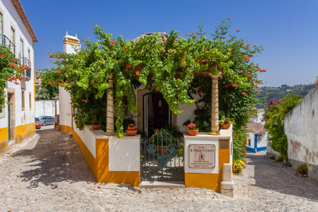 Obidos, Portugal - August, 2015: Sao Thiago Manor Guest House. Obidos is a medieval town still inside castle walls, and very popular among tourists.のeditorial素材