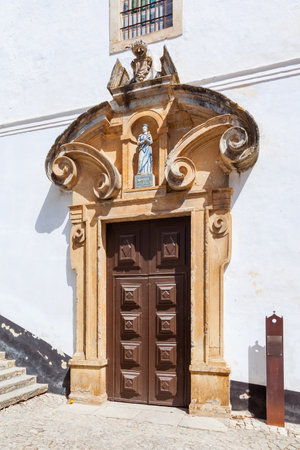 Obidos, Portugal - August, 2015: Portal of the Misericordia Church, a Renaissance and Mannerist church. Obidos is a medieval town inside walls, and very popular among tourists.のeditorial素材