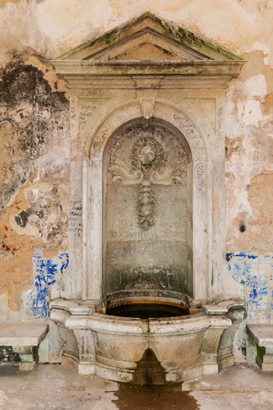 Interior of the vandalized Casa da Agua Water House, an 18th century fountain and reservoir built for the pilgrims of the Nossa Senhora do Cabo Sanctuary. Espichel Cape, Sesimbra, Portugal.の写真素材
