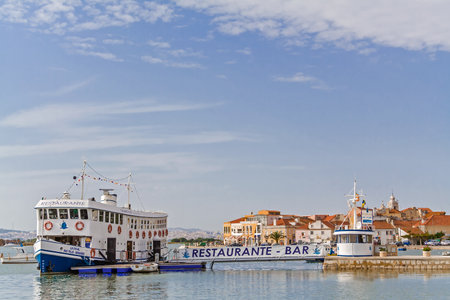 Seixal, Portugal. September 10, 2015: Seixal city entrance in Setubal District, Portugal. Also shown a floating bar restaurant built in an old ferry (Cacilheiro).のeditorial素材
