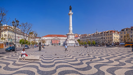 Lisbon, Portugal - April 14, 2017: Rossio aka Dom Pedro IV Square with Dom Pedro IV monument, Dona Maria II National Theatre in background and the typical Portuguese cobblestone pavementのeditorial素材