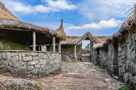 Pacos de Ferreira, Portugal - September 9, 2017: Interior of the reconstructed family nucleus building in Citania de Sanfins, a Celtic-Iberian prehistoric fortified Castro hillfort settlementのeditorial素材