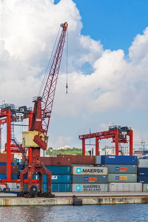 Lisbon, Portugal - November 05, 2018: Porto de Lisboa or International Port of Lisbon in the Tagus River. Cranes and shipping containersのeditorial素材