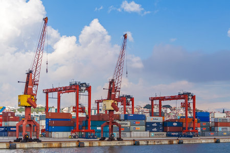 Lisbon, Portugal - November 05, 2018: Porto de Lisboa or International Port of Lisbon in the Tagus River. Cranes and shipping containersのeditorial素材