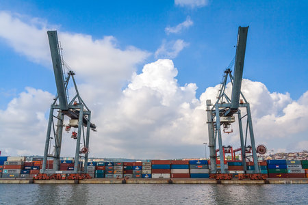 Lisbon, Portugal - November 05, 2018: Porto de Lisboa or International Port of Lisbon in the Tagus River. Cranes and shipping containersのeditorial素材