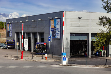 Coina, Portugal - October 23, 2019: Norauto car or auto service station and parts shop. Auto repair shop in Barreiro Planet Retail Park. Norauto is a French companyのeditorial素材