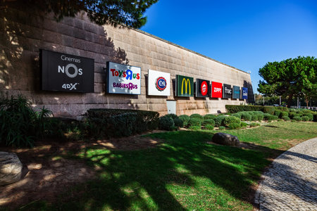 Almada, Portugal - October 24, 2019: Wall of the Almada Forum shopping center or shopping mall with signboards advertising some of the store in the mall, Almada Forum is one of the largest shopping malls in Portugal close to Lisbon.のeditorial素材