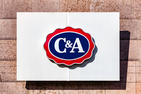 Almada, Portugal - October 24, 2019: Signboard advertising the C&A clothing store in a shopping center or shopping mall exterior wall.のeditorial素材