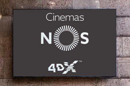 Almada, Portugal - October 24, 2019: Signboard advertising a NOS Cinema with 4DX in a shopping center or shopping mall exterior wall.のeditorial素材