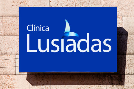 Almada, Portugal - October 24, 2019: Signboard advertising Clinica Lusiadas Clinic in a shopping center or mall exterior wall. Private health clinic UnitedHealth Groupのeditorial素材