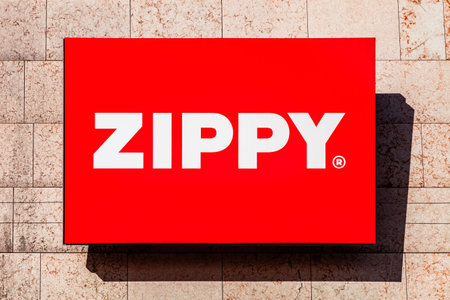 Almada, Portugal - October 24, 2019: Signboard advertising the Zippy store in a shopping center or shopping mall exterior wall. Zippy is a children and baby clothing chain store from SONAE corporationのeditorial素材