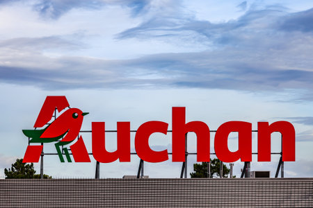 Coina, Portugal - October 23, 2019: Auchan logo or symbol in the Barreiro Planet Retail Park. Auchan is a French hypermarket, supermarket or superstore chainのeditorial素材