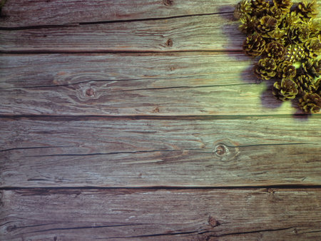 Christmas motifs and celebrations with gifts on a wooden background, with space to place textの写真素材