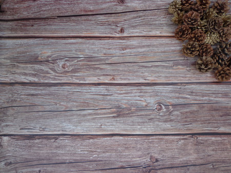 Christmas motifs and celebrations with gifts on a wooden background, with space to place textの写真素材