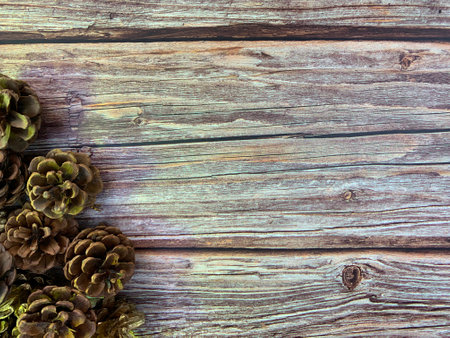 Christmas motifs and celebrations with gifts on a wooden background, with space to place textの写真素材