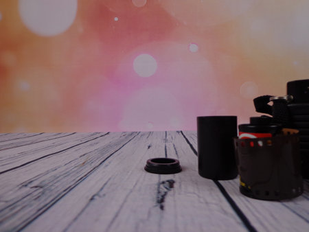 Old photo camera with flash mounted on woodenの写真素材