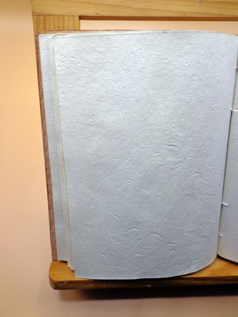 Open notebook, on lectern with blank space for textの写真素材