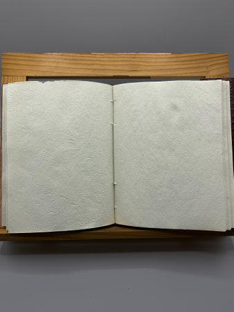 Open notebook, on lectern with blank space for textの写真素材