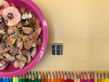 Color pencils and pencil sharpener, empty space to place textの写真素材