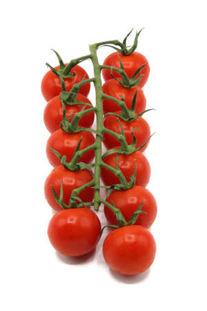 Cherry tomatoes in deep red branchの写真素材