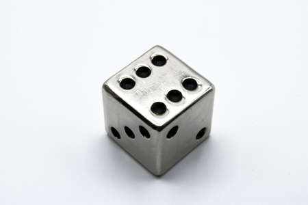 Metal dice, isolated on a white backgroundの写真素材